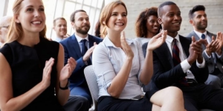 People sitting and clapping